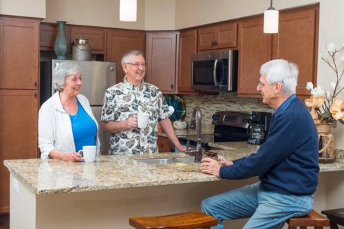 senior residents talking in an independent living apartment home