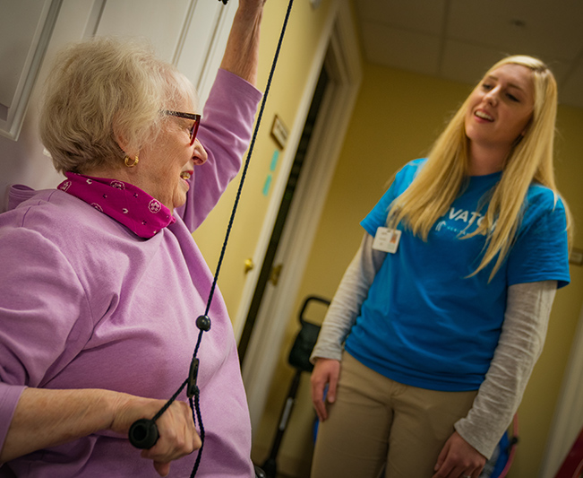 Otterbein physical therapist working with Otterbein resident