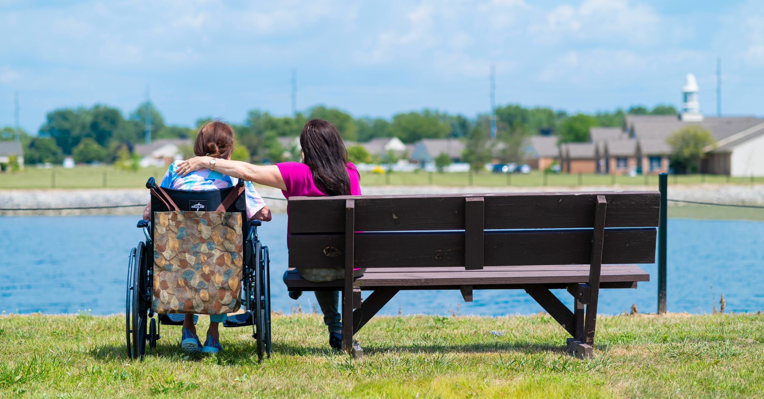 Otterbein resident sitting outside next to an Otterbein staff member.