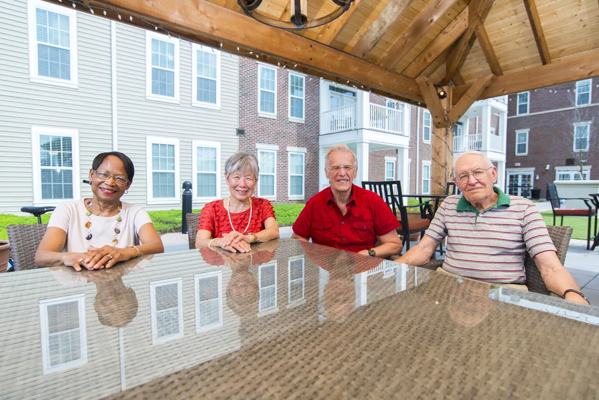 Otterbein Lebanon residents sit outdoors on the patio