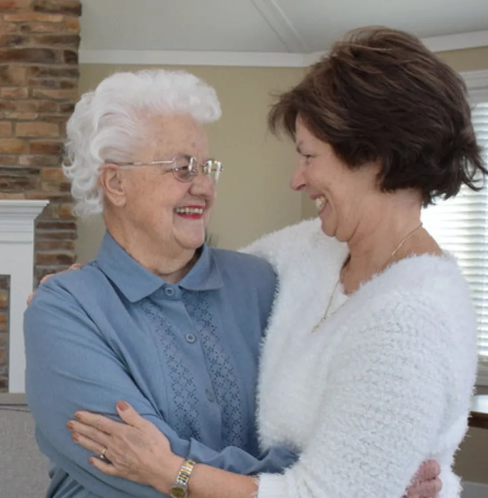 Otterbein resident and family member embrace