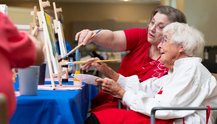 Residents taking a painting class