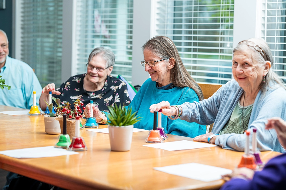 Otterbein small hosue elders doing art projects at the large table