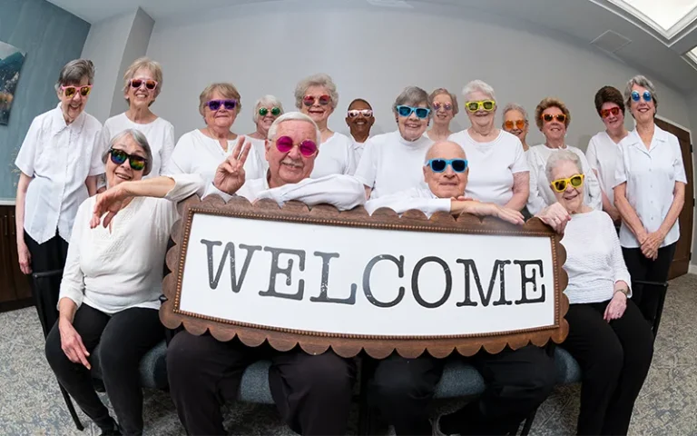 Otterbein residents holding a Welcome sign
