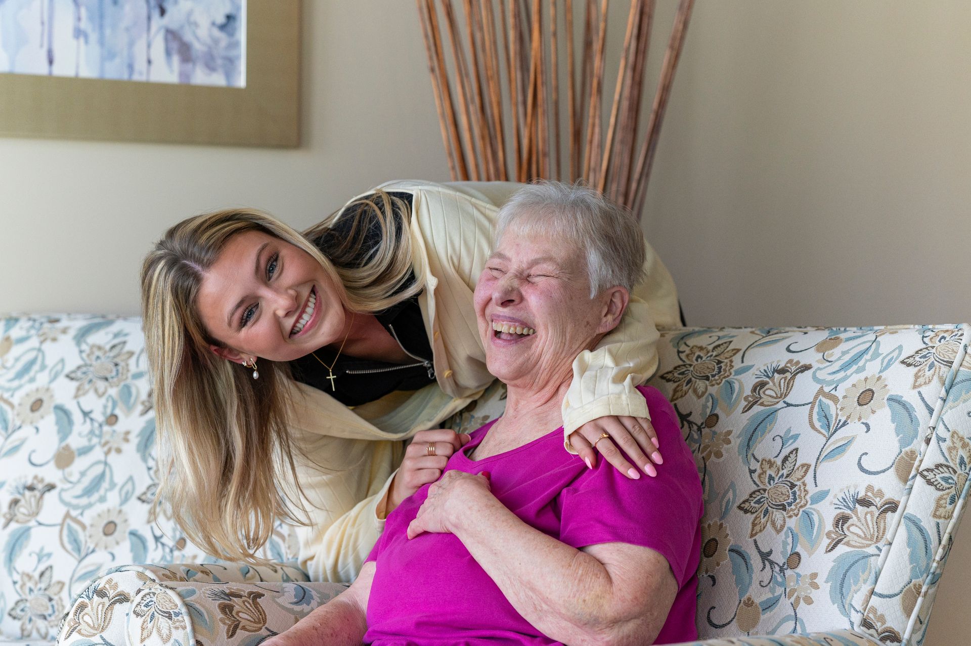 Otterbein resident and partner embracing with smiles and laughter